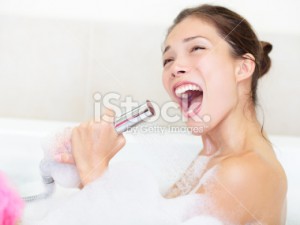 stock-photo-18318945-woman-singing-in-bath-shower